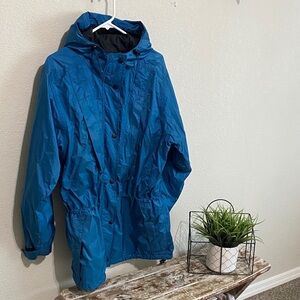 REI Teal Gore-Tex raincoat. Great for many outdoor activities.